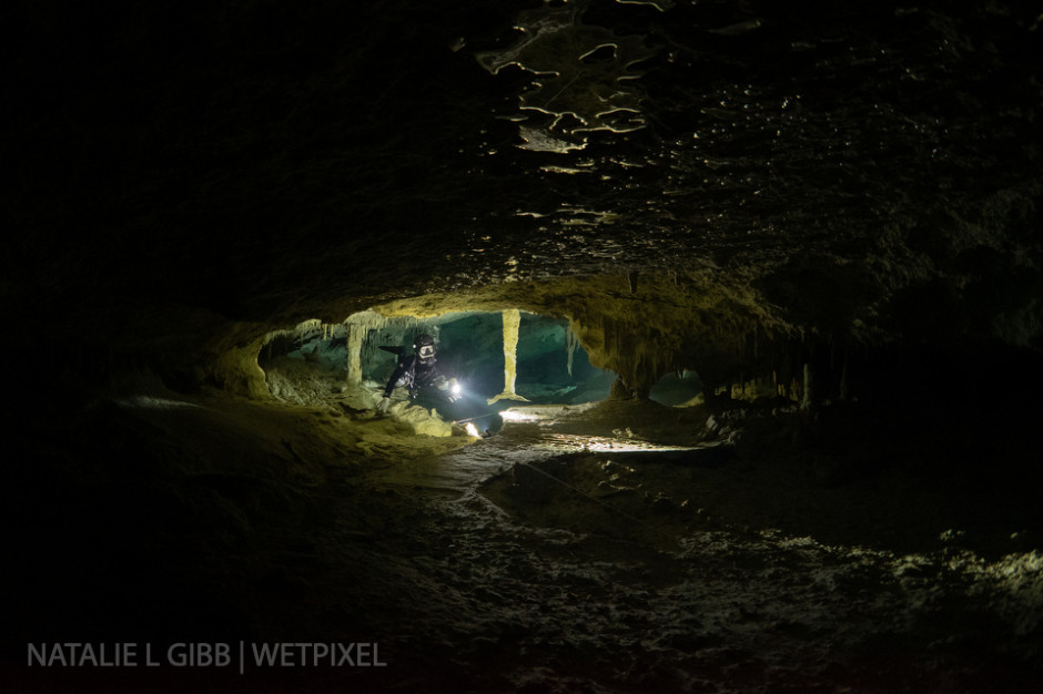 A single light behind diver Hana Cho and her cave light were used to create this shot in a tunnel at Cenote Nohoch Nah Chich. 