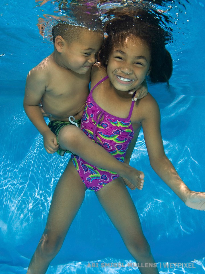 Brother and sister all smiles in the pool!