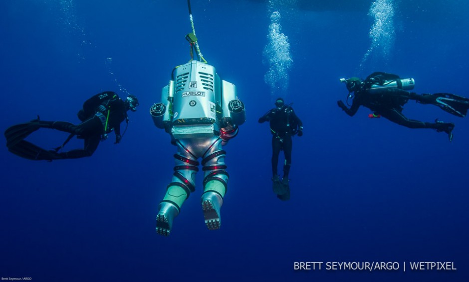 Safety divers from the Hellenic Navy swim with the Exosuit.
