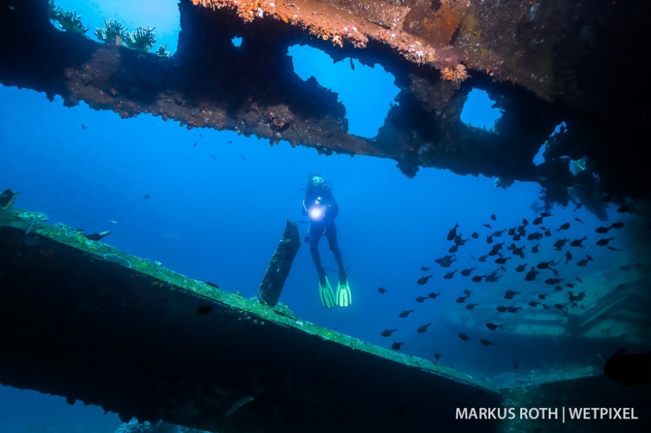 Diver exploring the Pillbox wreck in Manokwari. 